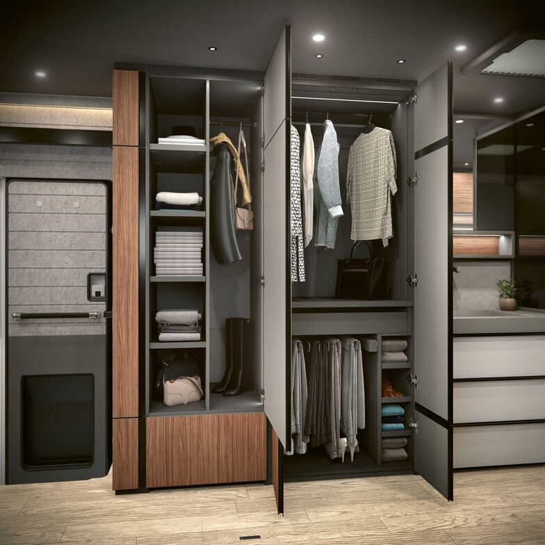 Grande armoire à habits avec penderie séparée pour les pantalons.